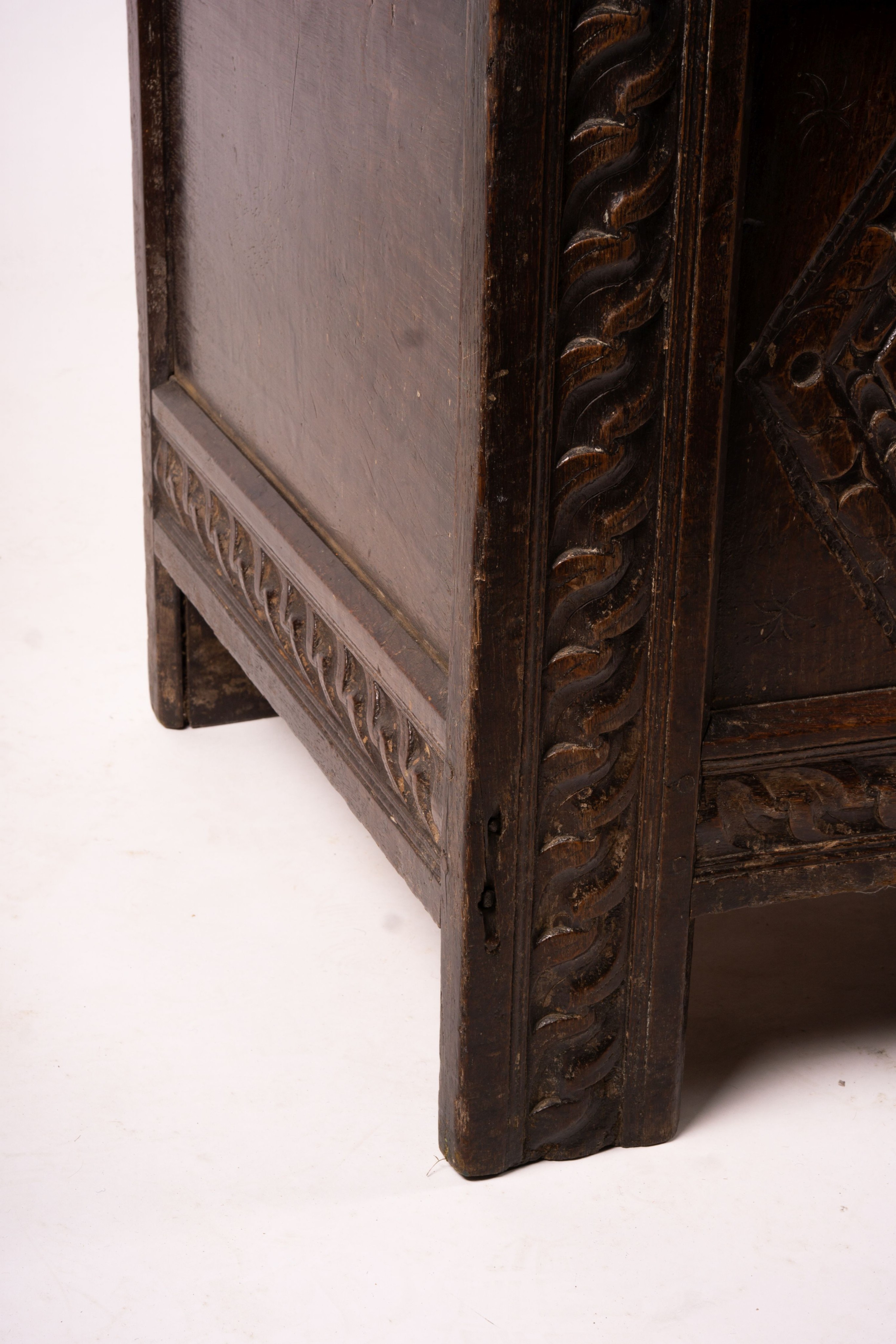 A 17th century carved panelled oak coffer, length 115cm, depth 56cm, height 67cm